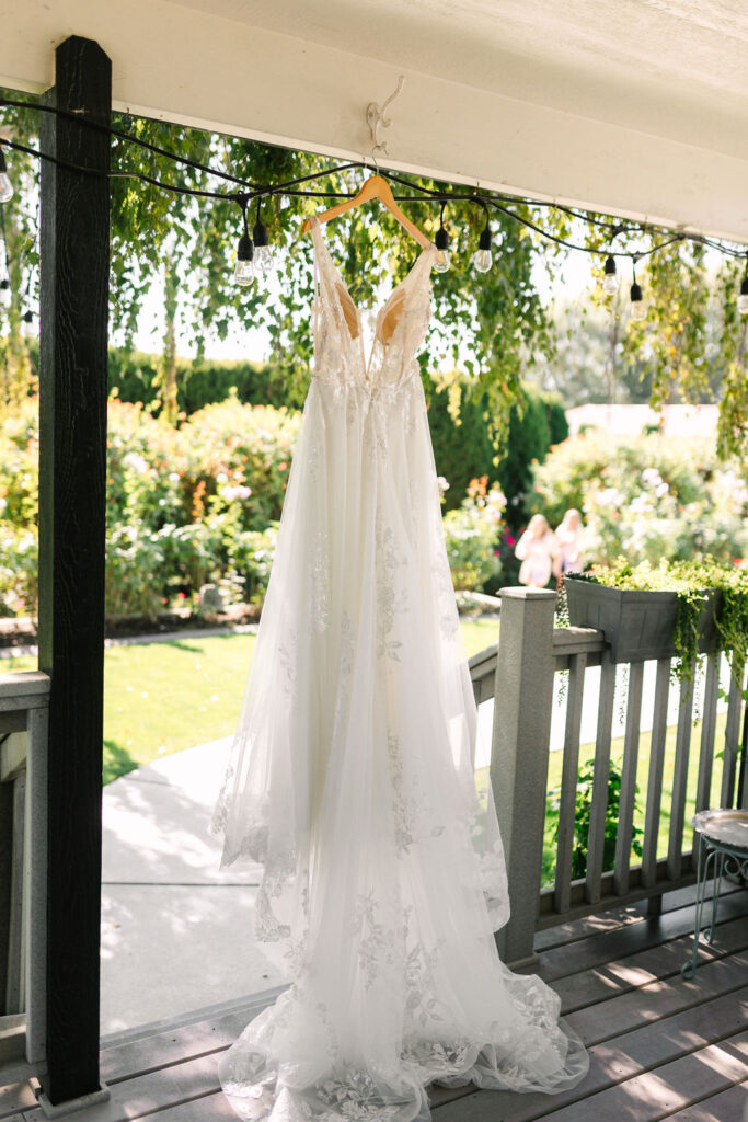 wedding dress hanging on the bridal suite porch