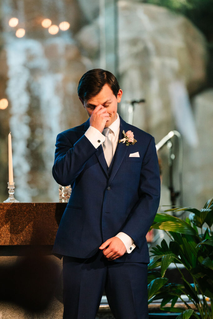 groom in tears as he watches his bride come down the aisle