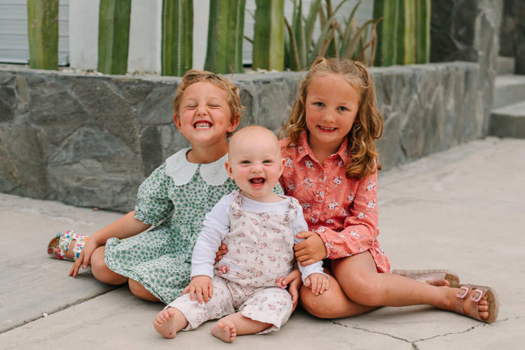 Savor the beauty of simplicity by letting the kids be kids during your vacation family photos, capturing genuine laughter and joy.