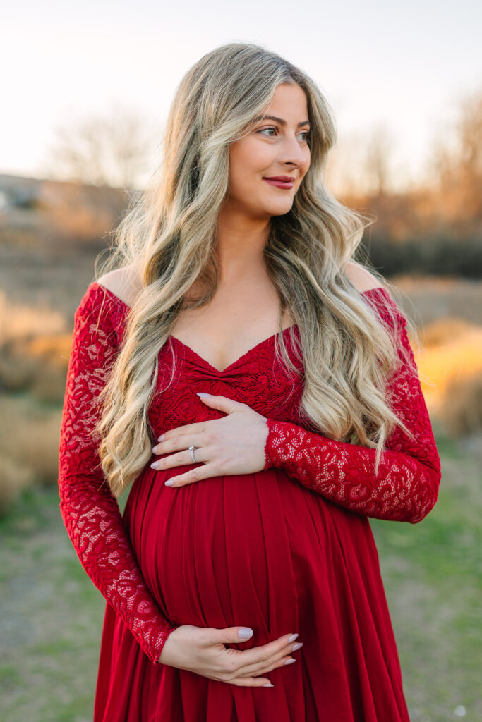 A glowing Anne Marie in a perfect dress, capturing the anticipation of welcoming their first baby in February 2024.
